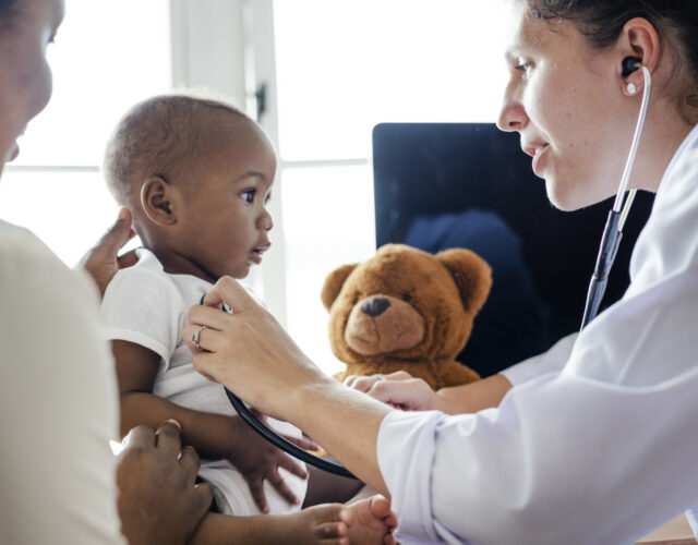 Baby visiting the doctor for a